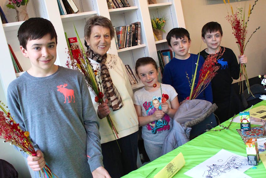 Rudy Magliaro, 13, from left, Hazel Williams, Lucy Campbell, 7, Sonny Magliaro, 9, and Luca Magliaro, 10, were decorating palms at St. Mary’s Polish Church in Whitney Pier on Saturday.