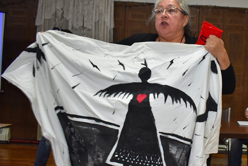 Elizabeth Marshall, a member of the Mi’kmaq Warrior Society, speaks during a public meeting in Donkin to discuss concerns about the nearby mine’s plans to conduct underwater seismic testing. (Cape Breton Post photo)