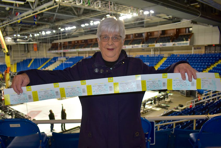 Brenda Snow of Westmount proudly displays her Scotties Tournament of Hearts tickets at Centre 200. With the tournament only months away, tickets were available for pickup on Wednesday and Snow took full advantage to get her hands on her ticket package.