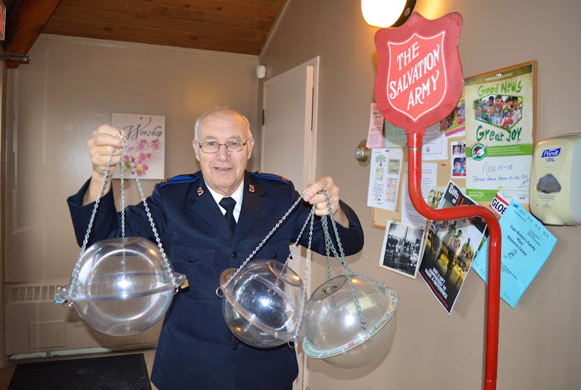 Sgt.-Maj. Fred Courtney of the Glace Bay Salvation Army prepares kettles for the upcoming red kettle campaign.