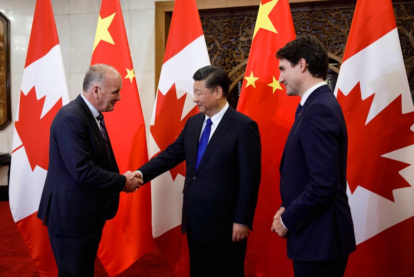 Sydney-Victoria MP Mark Eyking shakes hands with China’s President Xi Jinping as Prime Minster Justin Trudeau looks on during a recent visit to China.
