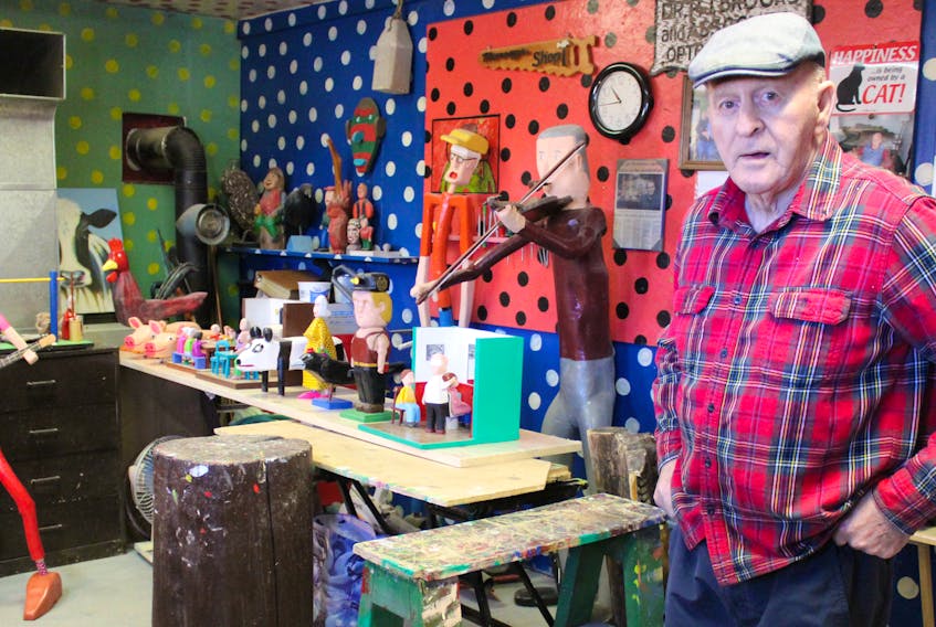 Murray Gallant, 80, stands in The Barn, his artist studio located in the backyard of his New Waterford home on Monday. Around him are some of the wooden sculptures the folk artist will have on exhibit at his solo show happening throughout the month of February as part of the New Waterford Library’s Heritage Day initiative.