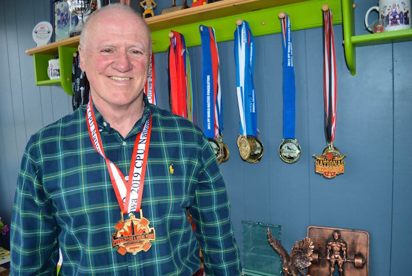 Ron Delaney of Sydney is shown wearing a gold medal he won at the 2019 Canadian powerlifting championships held in Ottawa in March, along with his many other accolades. The 67-year-old, a seven-time world title holder, is being inducted into the Cape Breton Sport Hall of Fame on June 1.