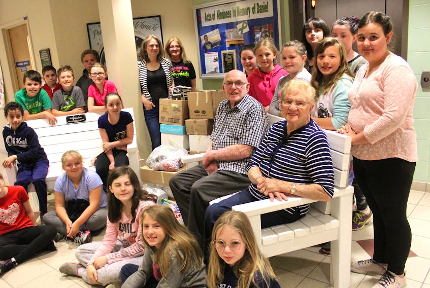 Ferrisview Elementary recently presented a collection of pop tabs to the family of 18-year-old boy Daniel Arsenault, who died suddenly in December. Pictured sitting in front, from left, are Nathaniel Winter, Kyla Francis, Ava Newman, Paige Baker, Summer Marsh, Makenna Rumsey, along with Arsenault’s grandparents Alfred and Jean Landry of North Sydney. Standing, from left, are Aiden Phillips, Reilly Serroul, Ashton Clarke, Justin Matthews, Jaynie Keeping, Grade 5 teacher Monique Buffet, teacher’s assistant Janet Wilkie, Jenna MacKenzie, Emily MacKenzie, Abby MacIsaac, Brooke MacDermid, Maddie Clarke, Claire Russell-Bradbury and Georgia Timmons.