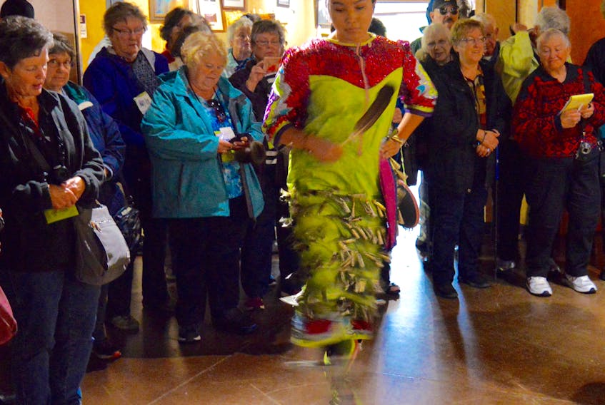 This file photo shows Mi’kmaq dancer Montana Marshall performing for a group of tourists at the Membertou Heritage Park. The group that was visiting Sydney on the Norwegian Dawn cruise ship were treated to an interactive afternoon of Mi’kmaq music, culture and history. The latest numbers show that Nova Scotia tourism is continuing to bring more and more revenue into the province.
