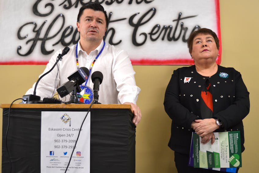 Eskasoni First Nation Chief Leroy Denny, left, addresses the media at the Eskasoni Health Centre on Thursday as health director Sharon Rudderham looks on. Denny said multiple deaths have left the community grieving in recent weeks and long-term funding is urgently needed to deal with a mental health crisis.
