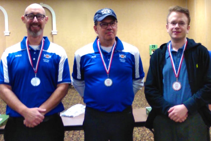 The top three participants in the pistol competition at the 2018 Nova Scotia Airgun Provincials in Truro, were from left, Mike Kelly of East Bay, second place, Joe Macholl of Mira, first place, and John Rooney of Halifax, third place.