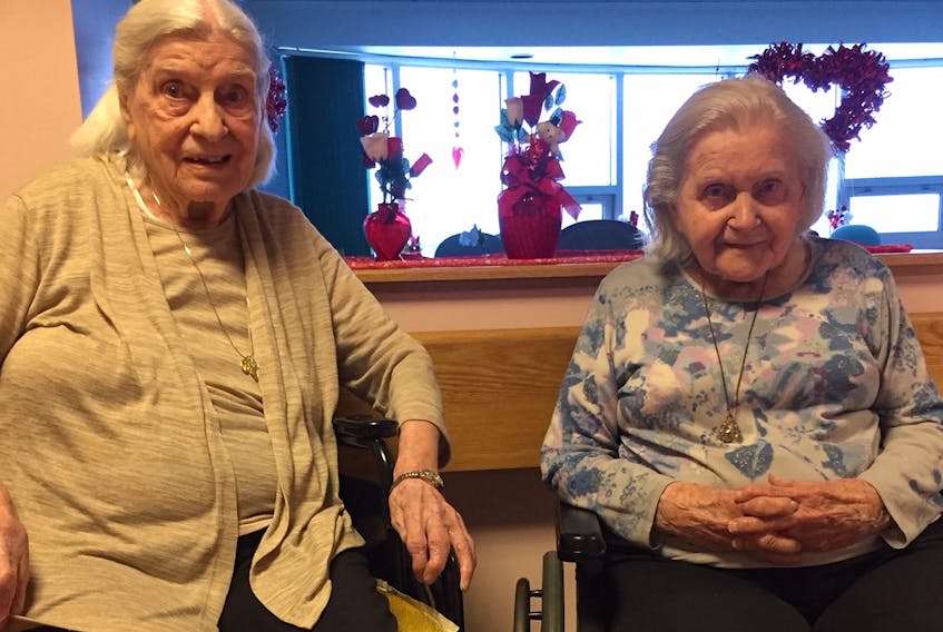 Julia Sigut, left, who will celebrate her 107th birthday on Wednesday, is shown here with her sister Lillian Sigut, who will turn 104 on May 19.