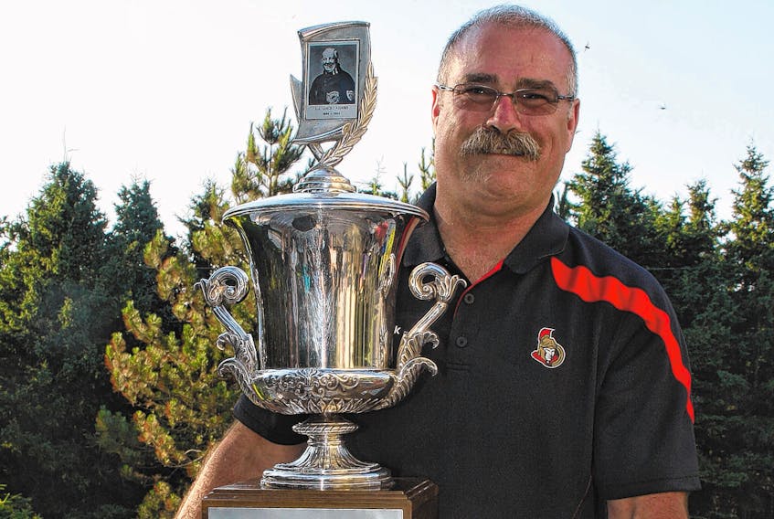 Former National Hockey League head coach Paul MacLean holds the Jack Adams Award as NHL coach of the year, which he won during the 2012-13 season as head coach of the Ottawa Senators. MacLean’s agent says the rumour about his client becoming the new head coach of the Cape Breton Screaming Eagles is not true.