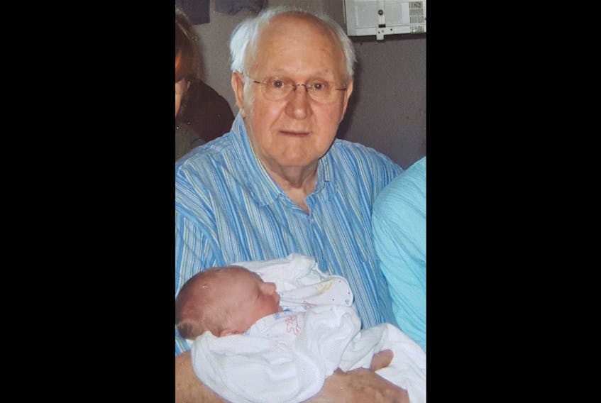 Ernie Slade is shown with his first great-grandchild Mason in happier times.