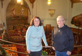 From left, Rita Johnston and Billy MacDonald stand on the balcony at the St. Andrew’s Presbyterian Church in Sydney Mines. The church will host The Miners’ First Noel concert on Dec. 29. All money raised from ticket sales will go to the church.