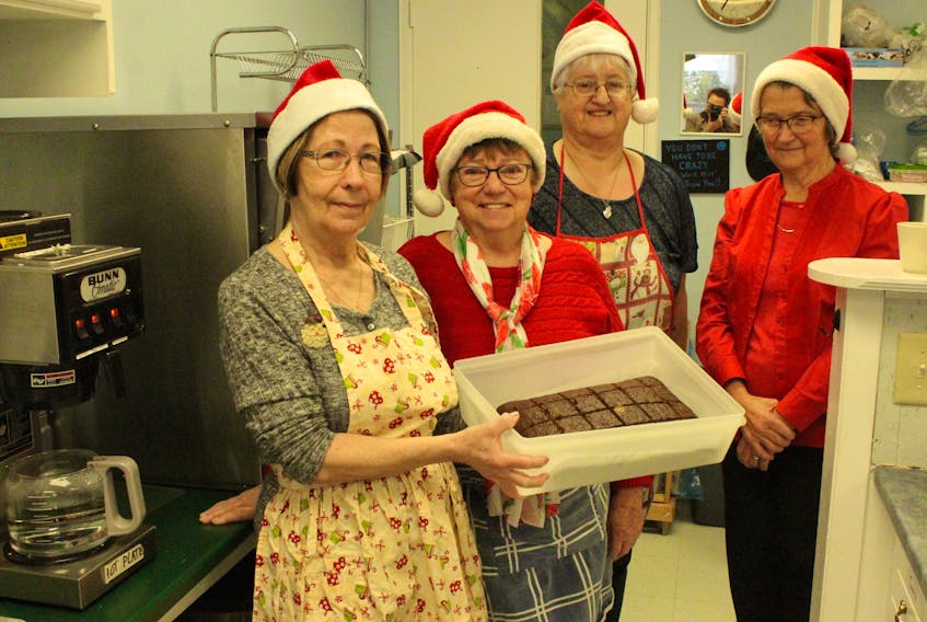 From left, Frances Mullins, Pauline Mesher, Debbie Campbell and Anne Kennedy made dessert for a special seafood lunch held recently at the former Big Wave Café in the Main-a-Dieu Coastal Discovery Centre. The lunch was part of the grand opening of Kids-Zone, a children’s activity room in the centre.