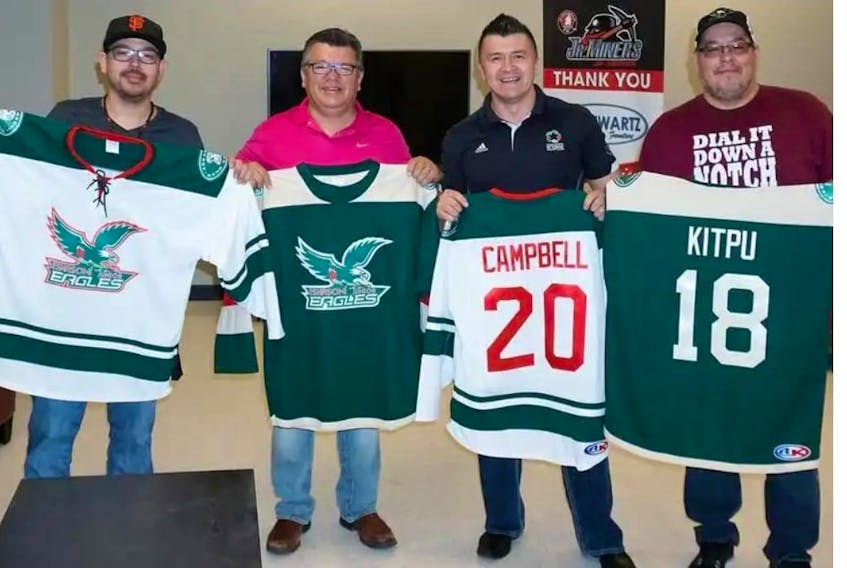 In this file photo, the Eskasoni Junior Eagles unveiled their jerseys in May for the upcoming Nova Scotia Junior Hockey League season. The team will begin its inaugural year on the road Friday, while the team’s home-opener is set for Sunday. Holding the jerseys, from left, are assistant coach Pierre Gould, Eskasoni band councillor Dion Denny, Eskasoni Chief Leroy Denny and Charles Denny.