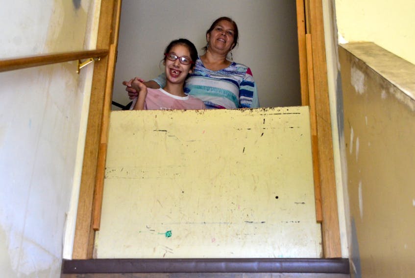 Martha Lewis and her daughter Annie Peck at their split-level home in Wagmatcook. Lewis has been trying to get a single-level home for her family in the community for a decade.