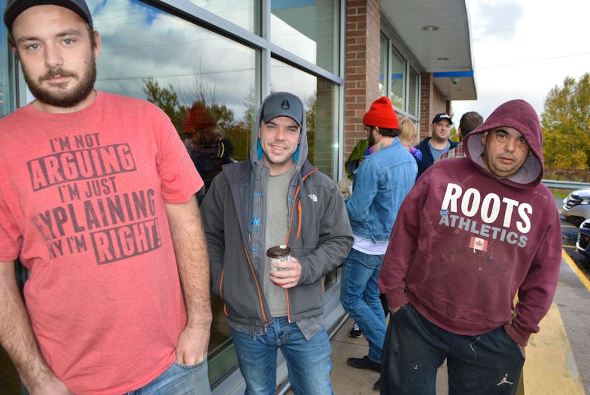 Ryan Dixon, left, of Glace Bay and Kyle Barrett (behind), Coxheath, wait in a small line for cannabis products at the NSLC outlet in Sydney River on Thursday. The day before, Oct. 17, the Sydney River store was the second-busiest in the province on Canada’s opening day for the legalization of cannabis, with 650 transactions as of 5 p.m.
