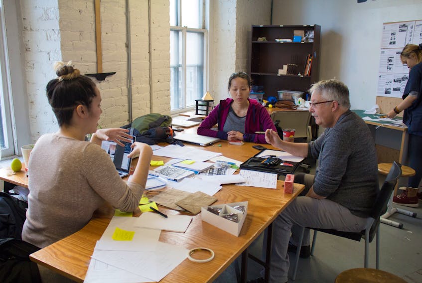 Left to right, Kassiday Bernard of Wagmatcook, discusses her Alexander Graham Bell project with Kathleen Hoang and instructor Dean McNeil at the Nova Scotia College of Art and Design in Halifax.