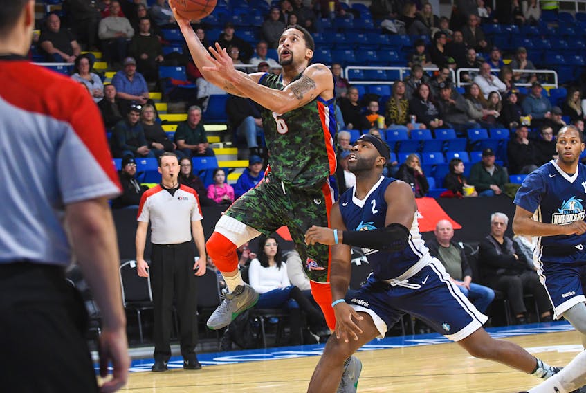 Rick Bodiford of the Cape Breton Highlanders drives the lane past Ta'Quan Zimmerman of the Halifax Hurricanes during Sunday's NBL of Canada provincial matchup at Centre 200. Cape Breton couldn't maintain a 17-point first half lead and fell 108-104 to their mainland rivals.