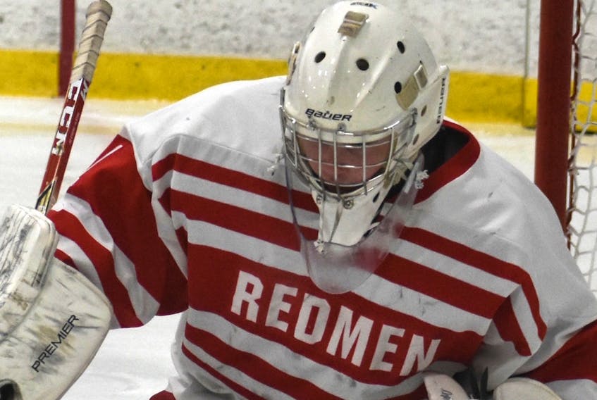 Shown above in this file photo from last season is Riverview Redmen goaltender Michael MacMullen wearing the team's white and red jersey. The name "Redmen" displayed on the front of the Riverview High School hockey jersey will soon be taken off and replaced with something new and different.