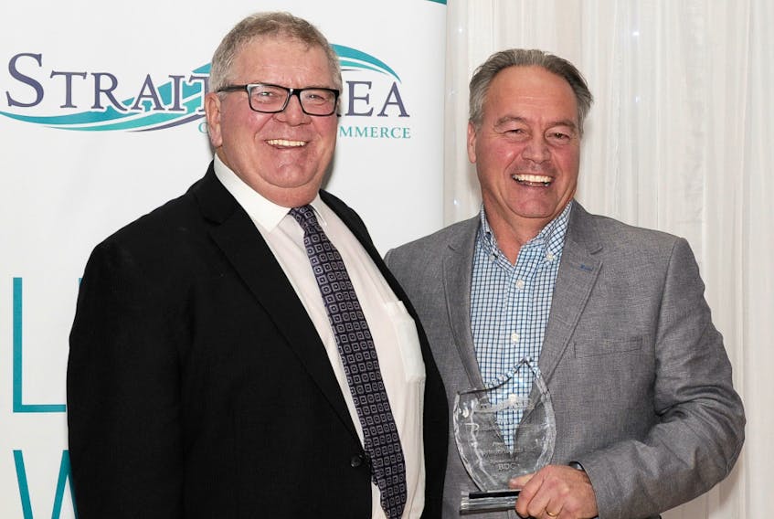 Richie Mann, left, president of the Strait Area Chamber of Commerce and vice-president of government relations for Melford Terminals, presented the excellence in business award to Polytech Products Ltd. general manager Reid Campbell at the chamber’s Fall Awards Dinner last week.