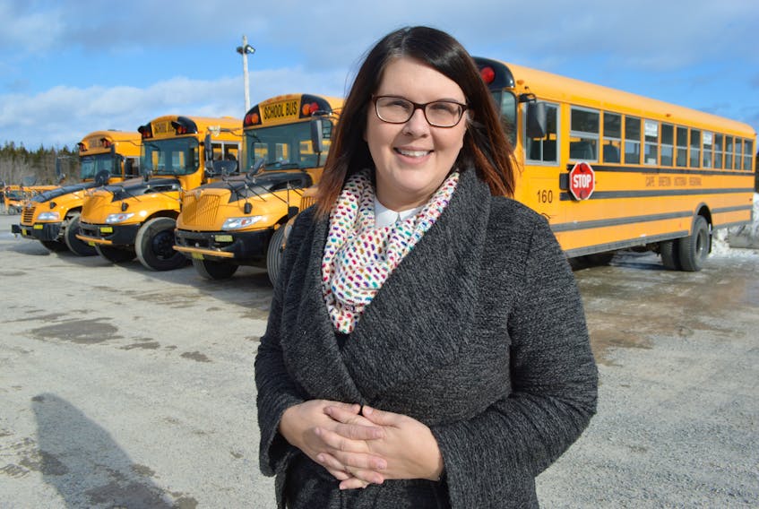 Tara Gaskell, manager of transportation for the Cape Breton-Victoria Regional Centre for Education, stands outside their operations centre in Prime Brook. Although Gaskell has many responsibilities within in her position, her role in school cancellation decisions has earned her the nickname, “the storm lady.”