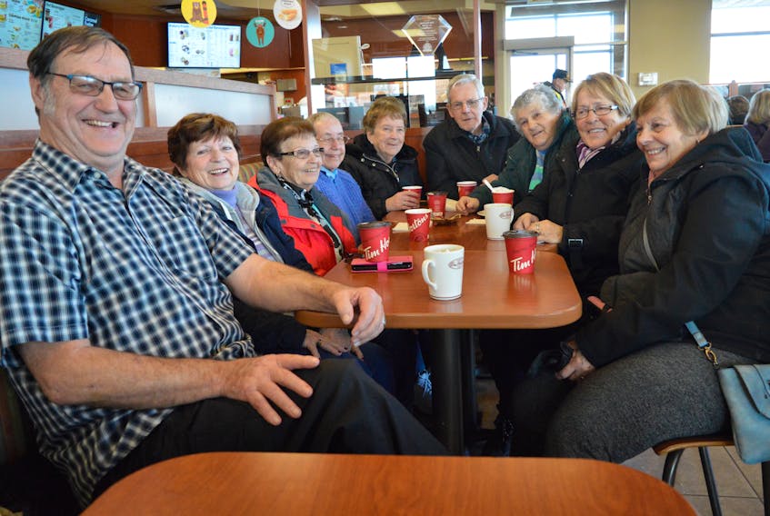 Pat Basker, from left, Mella Hodder, Mary Johnston, Tweet Monroe, Theresa Reid, Bud McInnis, Marg McInnis, Betty Power and Lorraine Fennell begin at the Emera Centre Northside walking track then go to a local coffee shop where they chat about politics and share some laughs.