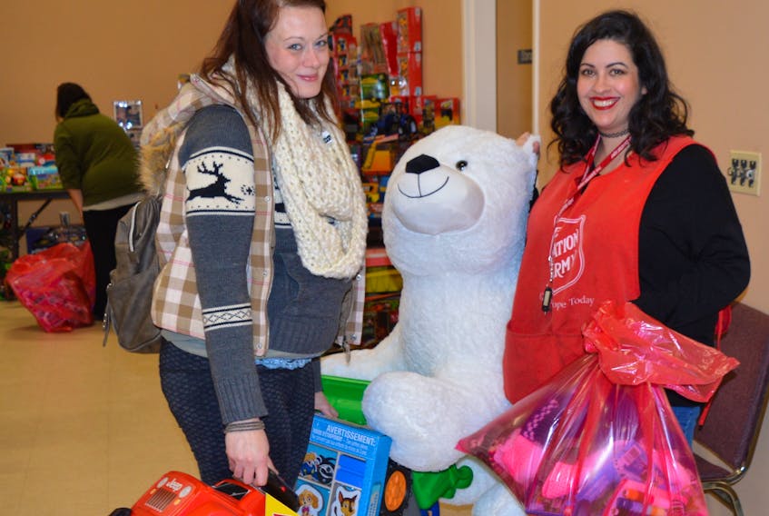 Former ServiCom employee Crystal Perry was over the moon after Salvation Army Community Church volunteer Amber Wareham helped her select some Christmas gifts for her four children. Perry was one of more than 500 workers who lost their jobs after the Sydney call centre suddenly shut down on Dec. 6.