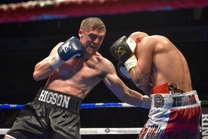 Kevin Higson of Hamilton, Ont., left, fires a punch to the body of Jose Francisco Zuniga of Aguascalientes, Mexico, during the co-main event of the All or Nothing boxing card at Centre 200 on Saturday. Higson won the match by unanimous decision after eight rounds in the super welterweight division.