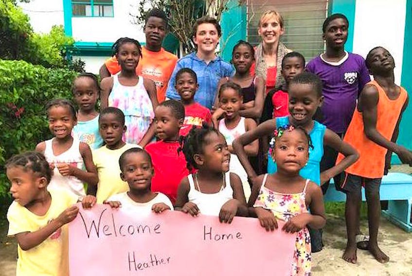 Heather Kearney and her son Mackenzie, 15, of New Waterford, back row, are greeted by children at the orphanage and school in Deschapelles, Haiti, in July 2017. The Kearneys will be volunteering at the orphanage from Aug. 2-9.