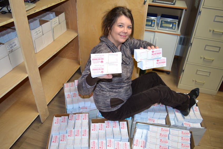 Tracey Hanrahan, office manager for the Glace Bay Minor Hockey Association, sits around thousands of tickets in their office at the Dominion rink. The tickets are ready as hockey family sellers file in steadily for extra tickets in anticipation of the association’s largest 50/50 draw of the year, which takes place Saturday.