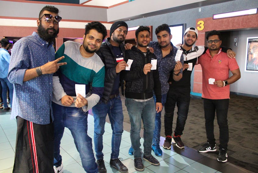 Jubin John, from left, Ashwin Zachariah, Amal Nath, Jijo Tom Raj, Ashik Augustine Siby, Abhiskek Kumar and Tiju Thomas hold up their tickets for the screening of the Indian film “Lucifer” on Sunday at Cineplex Cinemas Sydney. The seven Cape Breton University students are from Kerala, India, one of the main locations of the Malayalam language film. Cineplex Sydney started adding Indian films a couple of months ago due to the high number of requests they were getting from Indian students attending CBU.