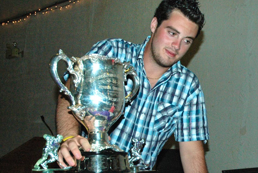 Howie Centre’s Kenzie Sheppard displays the Memorial Cup during an event at the Cedars Club in Sydney in July 2006. Sheppard won the 2006 Memorial Cup with the Quebec Remparts in Moncton, N.B.
