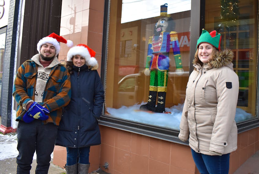 The Sydney Waterfront District has decorated the windows of some vacant buildings on Charlotte Street. The Christmas decorations can be found in former downtown businesses that include Yazers, Smart Shop Place and Jacobson’s. From left are decorators Bradley Murphy, Michelle Wilson and Tori Horvath from the Sydney Waterfront District, standing outside of the former Yazers Mens Wear shop.