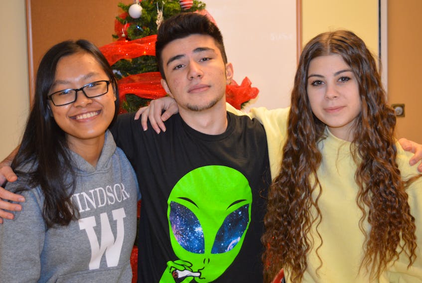 International students at Breton Education Centre in New Waterford Thy Lai, from left, Dogukan Dinler and Marta Mattioli are pictured above. The grade 12 students will be spending their Christmas break in Canada for the first time.