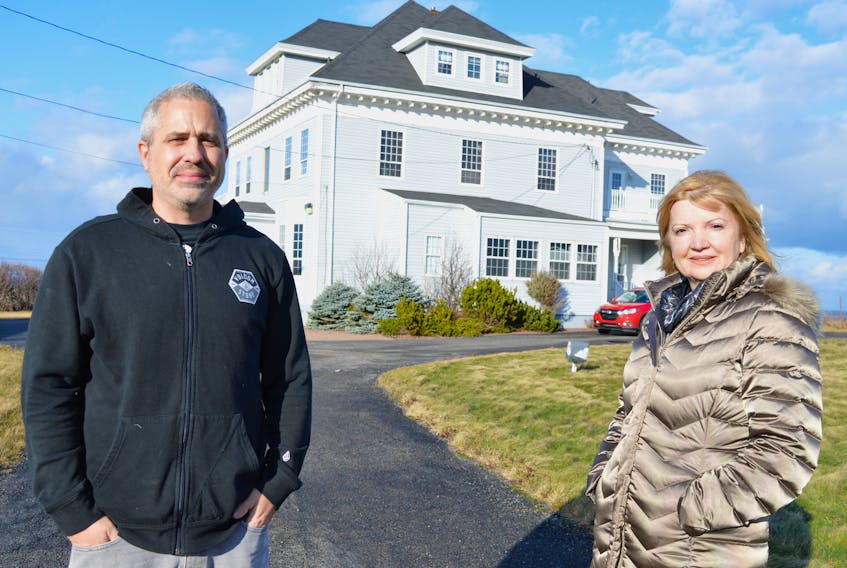 David Sawler, pastor of Lighthouse Church and executive director of Undercurrent Youth Centre, stands outside the former Vespers by the Sea bed and breakfast on Eleventh Street in Glace Bay with the owner Beverly Read of Port Credit, Ont., a native of Glace Bay. Read has donated her business to the Lighthouse Church who plan to bring the building back to what it was built for, a manse for the church.