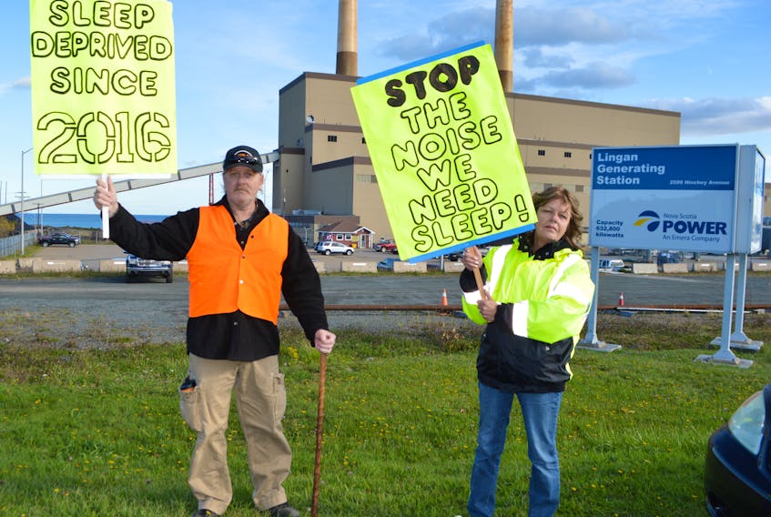 Wanita Mackie and her husband James Boutilier protest in front of the Nova Scotia Power Lingan generating station. Boutilier said they built a house on the Lingan Road in 2007 but two years ago noise from the generating station began waking them up all hours of the night.