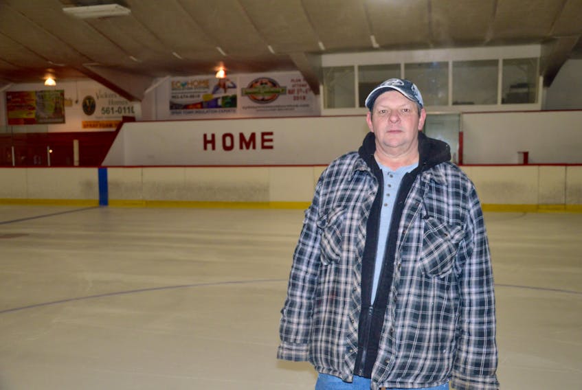 James (Crow) Foster stands near centre ice at the Sydney Mines and District Community Centre. Foster has been working at the rink as an operator for 40 years.
