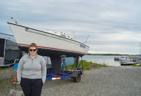 Maggie Bunbury, the administrator of the Sail Able program, stands beside the Freedom Independence at the Northern Yacht Club in North Sydney. The boat will be on the water during Saturday’s open house for the program that brings sailing to those with physical and mental disabilities.