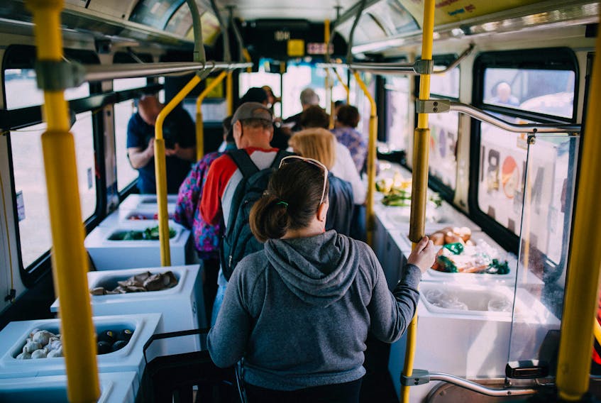 The above photograph shows people making their way through a specially modified Halifax transit bus that serves as a mobile food market. A similar initiative to be called the Good Food Bus is expected to surface in the CBRM in August as a 16-week pilot project.