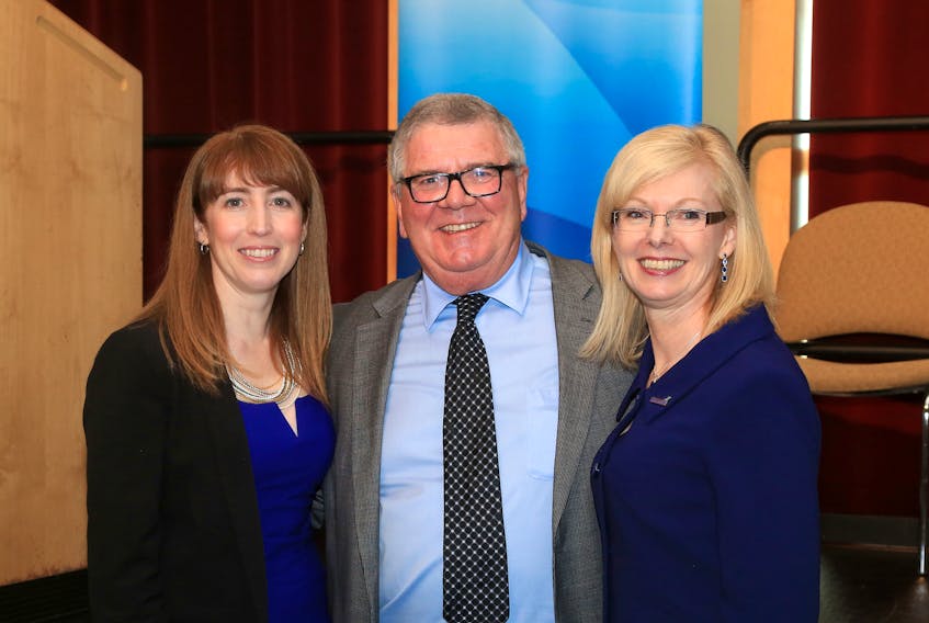 From left, Amanda Mombourquette, executive director of the Strait Area Chamber of Commerce, Richie Mann, president of the Strait Area Chamber of Commerce, and Joyce Carter, president and CEO of the Halifax International Airport Authority, pose for a photo at the Strait Region Business Update in Port Hawkesbury on Wednesday.
