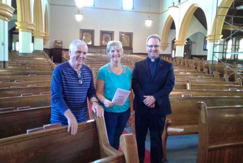 From left, Keith Burton, Elsie Bennet and Rev. Ritchie Robinson stand inside St. Mathew Wesley United Church in North Sydney. The Lakeside Cemetery will hold its annual musical fundraiser in support of the local graveyard on Sunday. All proceeds will go towards cemetery improvements and upkeep.