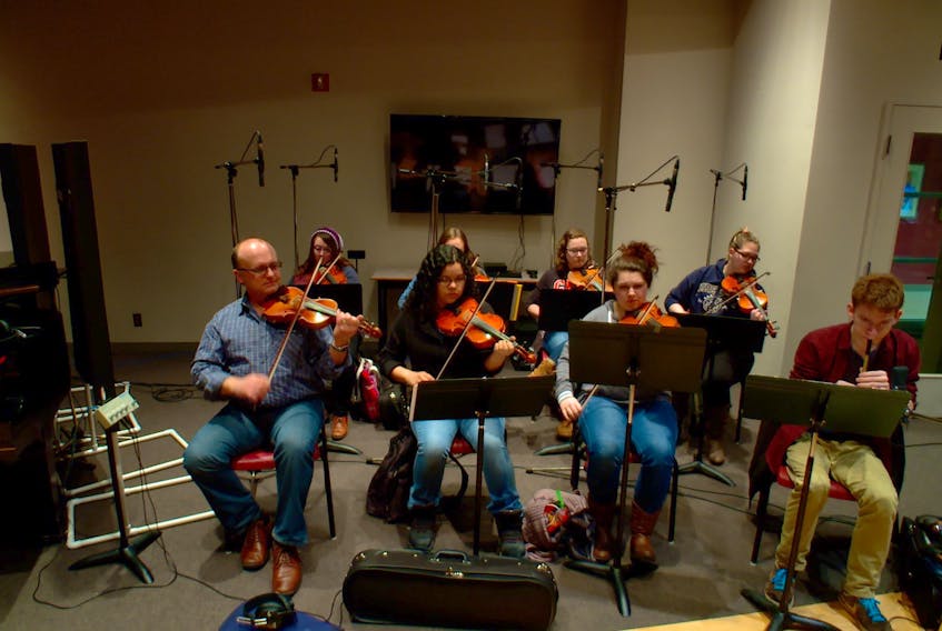 Instructor Kyle MacNeil, far left, leads a recording session with the Celtic music class enrolled in Cape Breton University’s traditional music program.