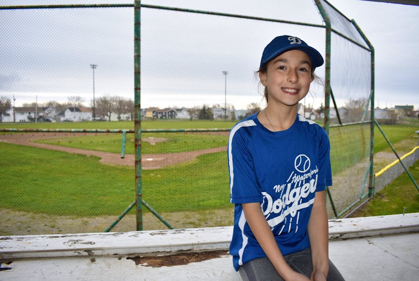 Sophia Hillier sits in the press box overlooking the Jerry Marsh Ball Field in New Waterford. While doing a heritage fair project last month, the nine-year-old discovered the field is the second-oldest baseball field in the country. Hillier, with the help of her father Chris, have applied to have the field recognized as heritage status