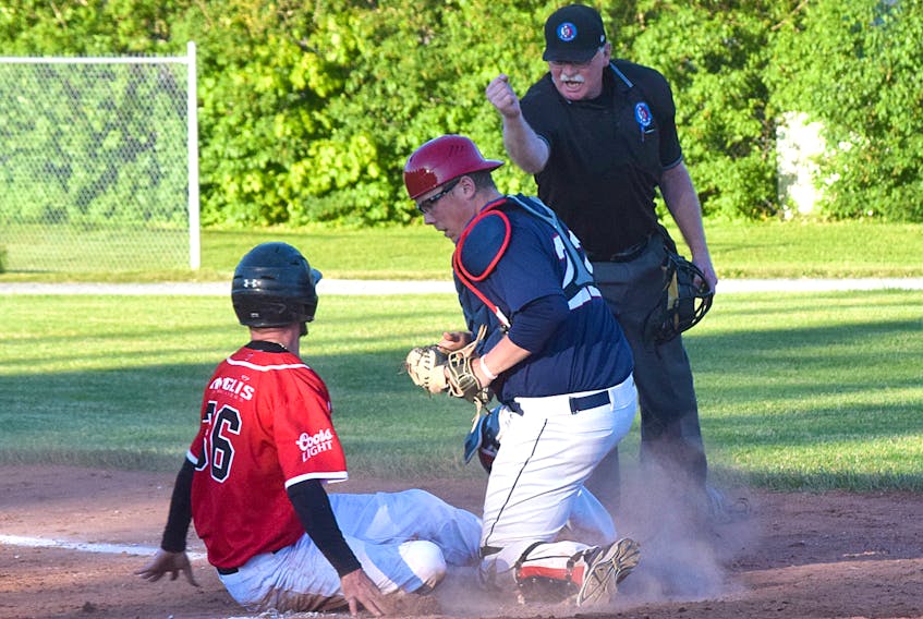 Sydney Sooners catcher Sean Ferguson tags out Adam Lombard of the Truro Bearcats during weekend action between the two Nova Scotia Senior Baseball League squads. The defending champion Sooners won two of the three games they played against the Bearcats on Friday and Saturday and now sit in second place with a 7-2 record.