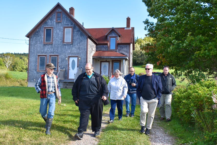 Big Pond Centre resident Roy MacInnis, left, leads members of the Nova Scotia Utility and Review Board on a site inspection of a proposed RV park and campground that could be located next to his farm. The UARB tribunal is visiting the rural Cape Breton area, some 40 km west of Sydney, as part of its hearing into an appeal of a CBRM decision to amend a bylaw to allow for the possible development of the undertaking. Above from left, MacInnis is joined by UARB hearing chair Roland Deveau, UARB member Roberta Clarke, appellant group representative Jim MacDonald, UARB member David Almon and developer Chris Skidmore.