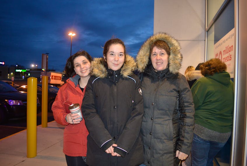 Selina Abousamara, Sarah MacKinnon and Amber MacKinnon were first in line for the Pet Smart Black Friday sale in Sydney.