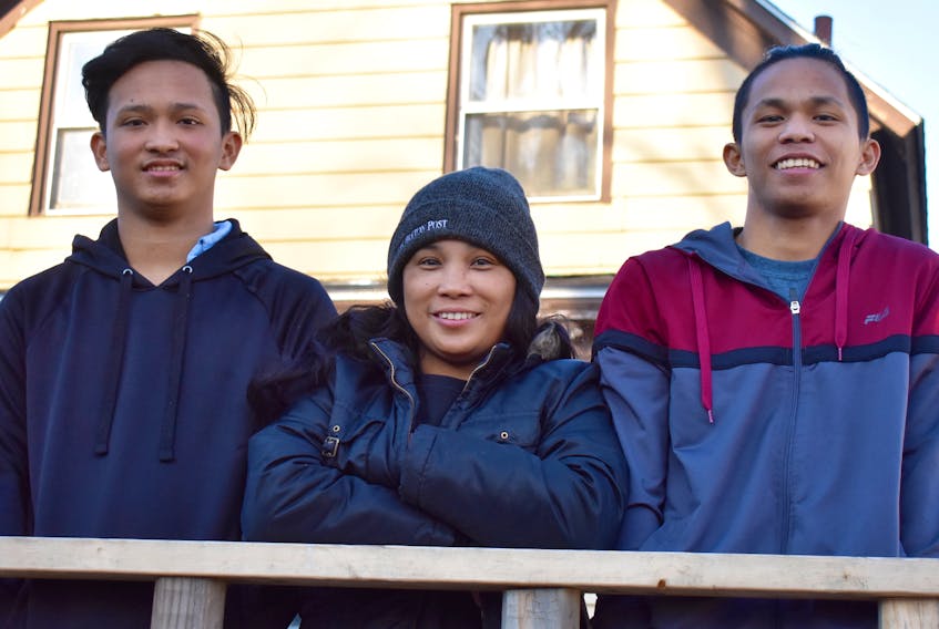 Ruby de Loyola, centre, is celebrating the one-year anniversary of her reunion with sons Jaden, left, and C.J. Although De Loyola has been in Canada for about six years, her boys only arrived in Cape Breton a year ago. Since then, the Filipino brothers seem to have adapted fairly well to life in their new country.