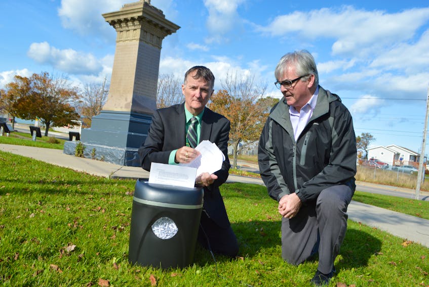 Sydney Crown prosecutors Steve Drake, left, and Gerald MacDonald shred the Nova Scotia Crown Association’s contract with the province at Davis Square in New Waterford, Friday. Drake said doing the shredding in the park was symbolic, as the park is dedicated the miners' fight for labour rights back in the 1920s. On Friday, Nova Scotia Premier Stephen McNeil announced the injunction against the prosecutors has been withdrawn and he’ll go back to the negotiating table on Monday.