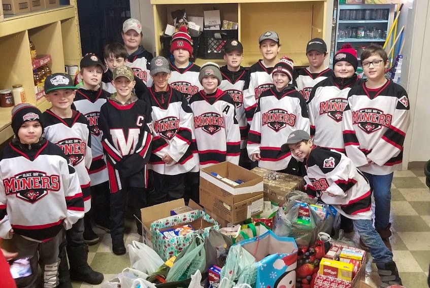 The Glace Bay Jets didn’t just spread Christmas cheer to the firefighters. They also wrote Christmas cards for Canadian soldiers and collected food for the Glace Bay Food Bank, as shown here. The team includes, in no particular order: Kristian Mackenzie, C.J. McNeil-Peach, Brennan Reid, Michael MacIssac, Riley Snow, Bradyn Attwood, Tyler McNeil, Logan Heffernan, Tristen Fowler, Ryan McNeil, Brennen Ransome, Marcus Kelly, Keigan Morrison, Ryder Cosnick, Matthew Boone, Owen Weyman, J.J. Watkins and Malcolm Boone.