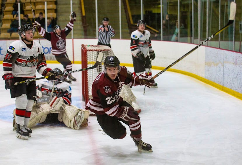 Avery Warner of the Strait Pirates, right, is shown moments after scoring the double overtime winner against the Kameron Miners in Game 3 of the Nova Scotia Junior Hockey League Sid Rowe Division final at the Port Hawkesbury Civic Centre last Friday. The Strait won the game 4-3 and later completed the sweep of the series, eliminating the Miners from playoff contention.