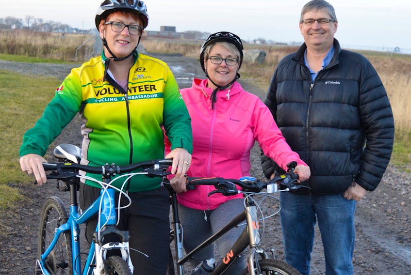 Collette Smith, left, and Adele MacKay, members of the cyclist group Velo Cape Breton, chat with Dave MacKeigan, vice president of bayitforward at John Bernard Croak Memorial Park in Glace Bay. MacKeigan said they are working with Velo Cape Breton and the Marconi Trail Blazers in hopes of seeing a 13 kilometre multi-purpose trail built on the old rail bed from Tower Road through Glace Bay to Gardiner Mines that would run through this park.
